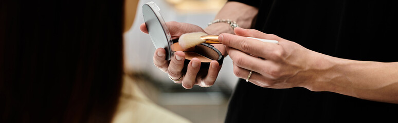 Talented stylist applying makeup on woman.