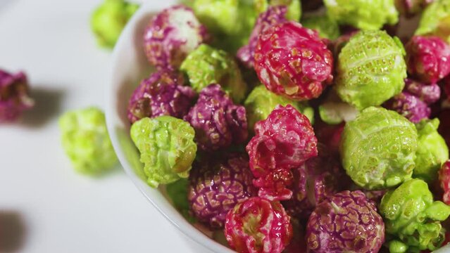 Colorful popcorn on white background close up.
