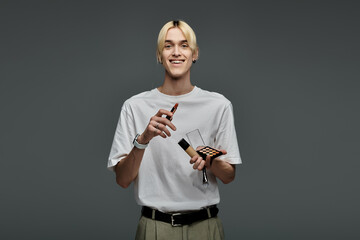 Cheerful man holding highlighter in hand.