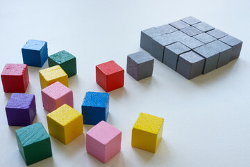 Obraz premium Diversity or ordering concept. Colored cubes and ordered structure of gray ones.