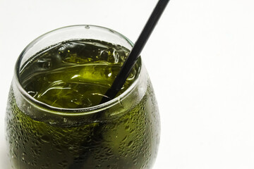Close up a glass of iced green tea on a white background