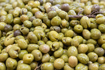 Marinated green olives background. Spanish appetizer