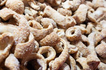 Pork rinds or deep fried pork skin background. Full frame