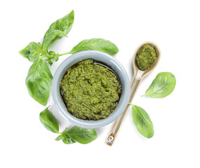 Fresh tasty pesto sauce and basil isolated on white, top view