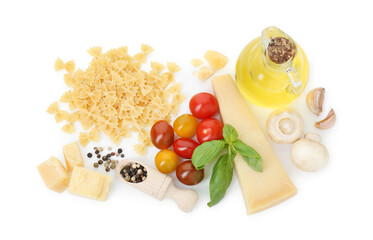 Uncooked farfalle pasta and ingredients on white background, top view