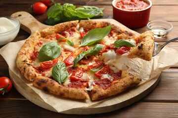 Taking piece of delicious Margherita pizza at wooden table, closeup