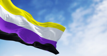 Genderqueer Pride flag waving on a clear day