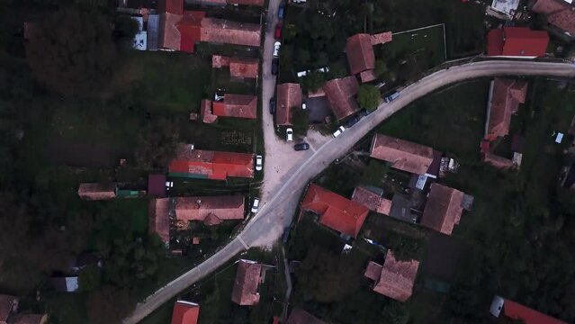 Detailed top down drone shot of the village Torocko, Rimetea in Romania. Seeing the detailed rooftops of the houses.