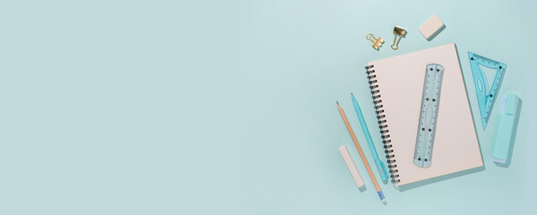 School supplies on blue background. Back to school concept. Top view. Copy space.
