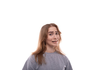 Smiling teenage girl with blond hair in a T-shirt on a white background