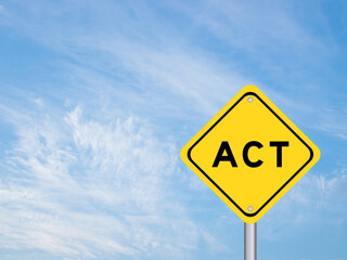 Yellow transportation sign with word act on blue color sky background