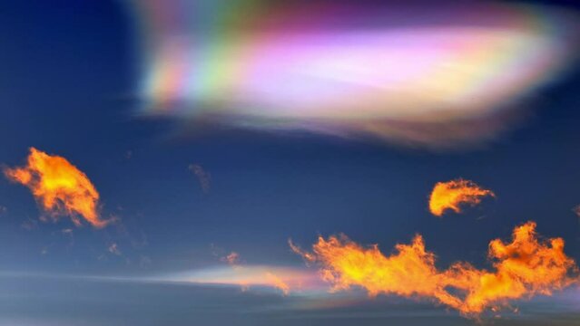 Beautiful Colorful Rainbow Clouds (Cloud Iridescence) and an Airplane Against Blue Sky in Sunset with Light Effect in Lugano, Ticino, Switzerland. (Time Lapse)
