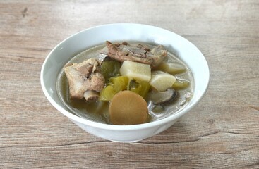 boiled slice radish and bitter cucumber with chop pork bone soup on bowl 