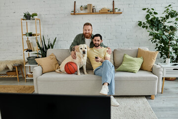 A bearded gay couple sitting comfortably on a couch, enjoying quality time with their loyal...