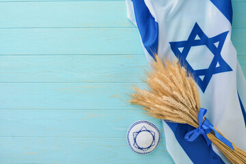 Shavuot jewish background. Ripe bouquet of wheat with blue ribbon with Israel flag and backgrounds....