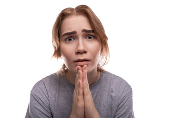 A teenage girl with light brown hair begs and asks for a request