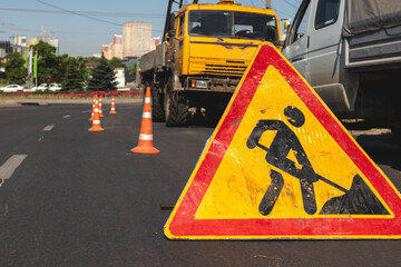 Close-up of a road works sign in the city