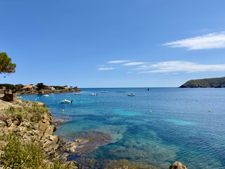 Obraz premium view from the Platja Ses Oliveres to the Badia de Cadaqués, bay with wonderful turquoise colored water near Cadaqués, Catalonia, Girona, Spain
