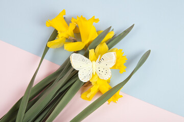 a bouquet of daffodils with a butterfly on it