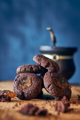 Pile of carob seeds with mate on blue background