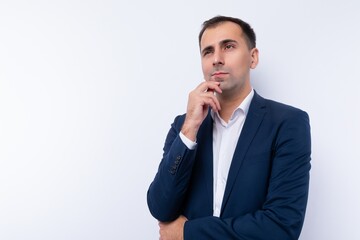 European 40 year old business man is puzzled by a problem and looks away