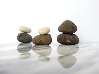 Zen basalt stone on white marble background