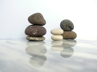 Zen basalt stone on white marble background