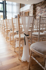 Decorative wedding chairs in the ceremony room