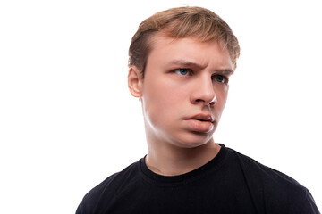 Fototapeta premium Blonde teenager dressed in a basic t-shirt thinks about a problem