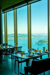 Hotel Five Stars Bürgenstock with Restaurant over Lake Lucerne and Mountain in Sunny Day in Bürgenstock, Nidwalden, Switzerland.