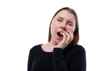 School-age girl with brown hair yawns