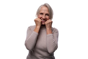 65 year old satisfied European mature woman with short hair on white background