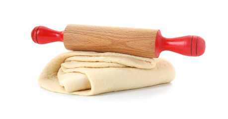 Raw dough and rolling pin isolated on white