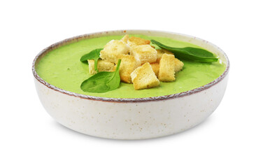 Delicious spinach cream soup with leaves and croutons in bowl isolated on white