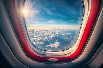 Fototapeta premium View of a cloud from an airplane window. Flying on an airplane. Organizing your holiday travel