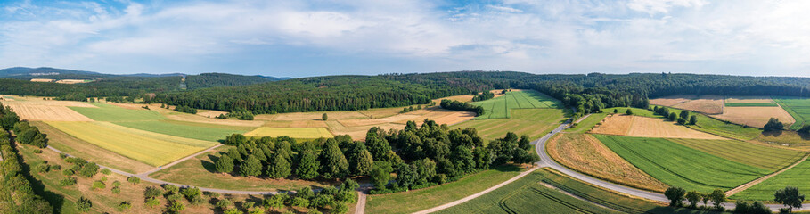Fototapeta premium Panoramic bird's eye view of fields, meadows and forests in the Taunus