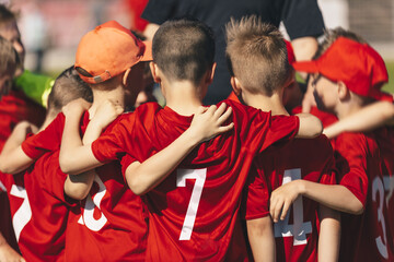 Happy Children United in Sports Team. Kids Building Team Spirit Altogether With a Coach. Boys in...