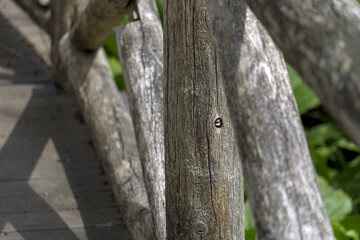 Fototapeta premium Hidden knot in wooden bridge support