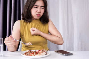 asian woman suffering form choke on food or choking during eating can be used for dysphagia or...