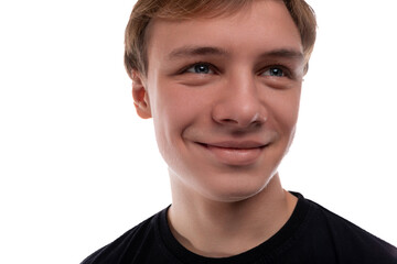 Portrait of a European teenager guy with blond hair against a background of copy space