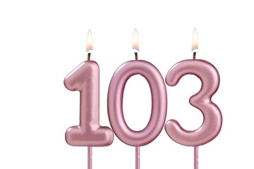 Lit birthday candle - Candle number 103 on white background