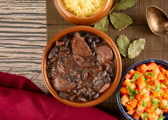 Brazilian Feijoada Food black bean stew with bacon and pork sausage ceramic bowl