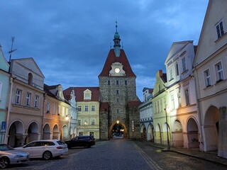 Fototapeta premium Domazlice historical city center and old town square with white tower,church and medieval gates,Chodsko region,Pilsen,Czech republic,panorama cityscape view