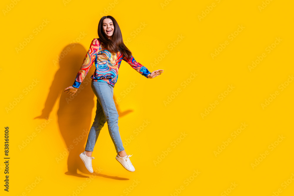 Canvas Prints Full size photo of pretty young girl walking jump amazed wear trendy colorful outfit isolated on yellow color background