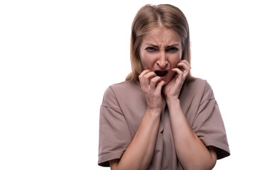 Excited 40 year old woman with white hair is afraid on white background