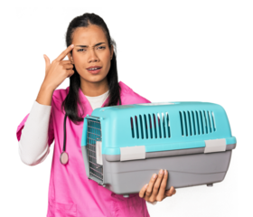 Young Filipina vet holding pet carrier showing a disappointment gesture with forefinger.