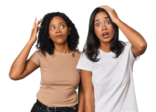 Young Latin friends in studio being shocked, she has remembered important meeting.