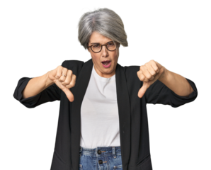 Caucasian mid-age female in business suit showing thumb down and expressing dislike.