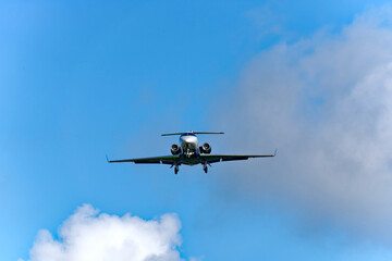 Private dark blue jet landing at Swiss airport Zürich Kloten on a cloudy spring morning. Photo taken May 28th, 2024, Kloten, Switzerland.