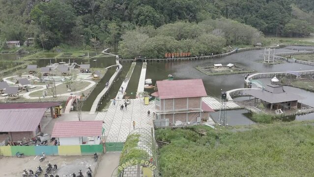 Establish aerial view of the water tourism in Banto Royo, Agam Regency, West Sumatra. d-log raw stock video